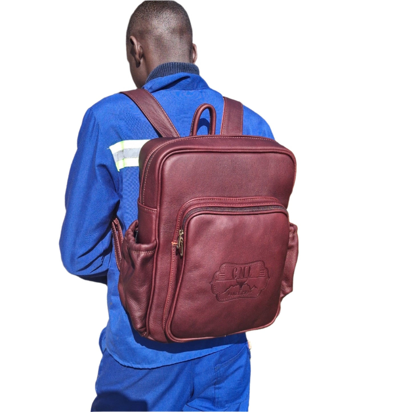 A worker in blue uniform carrying a beautiful Everyday Laptop backpack 15 with side pockets made by Cape Masai Leather on his back
