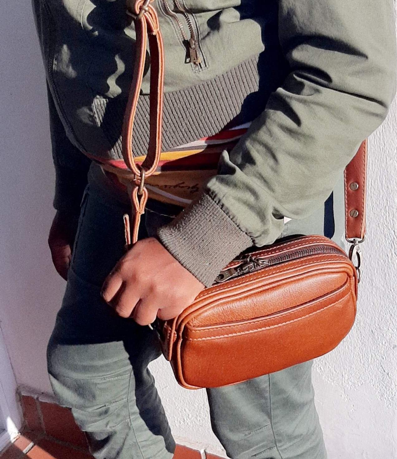 a beautiful lady carrying Lady X Leather Sling in Cape rust
