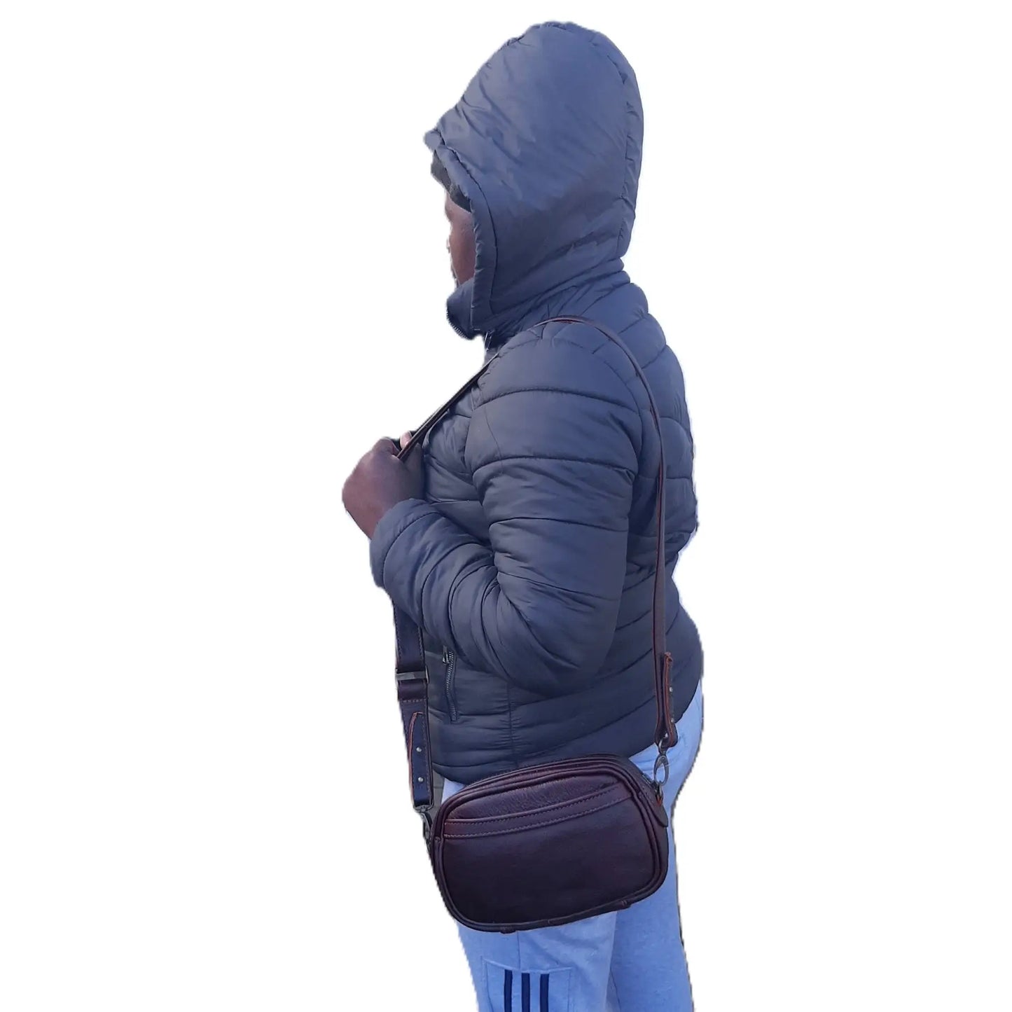 a beautiful lady carrying Lady X Leather Sling in dark tan