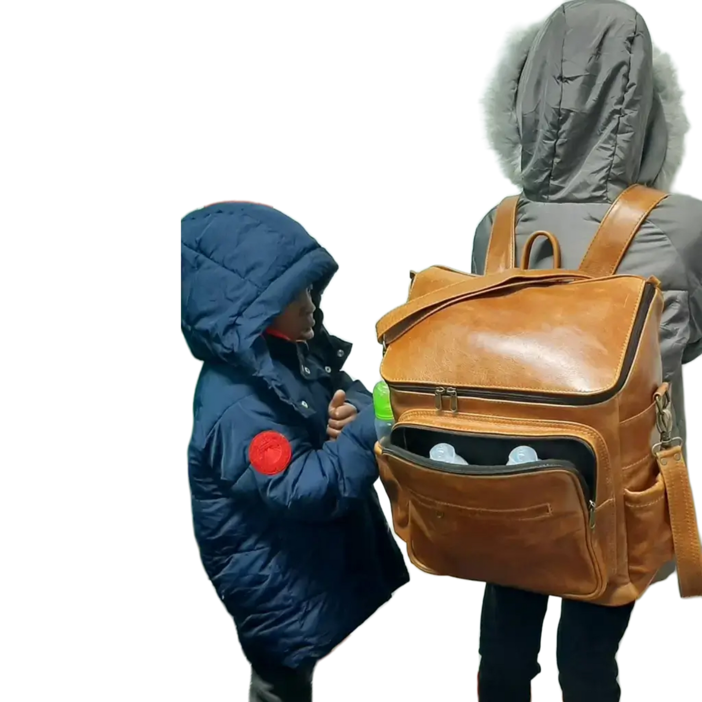 A little girl carrying a beautiful baby backpack - light tan colour