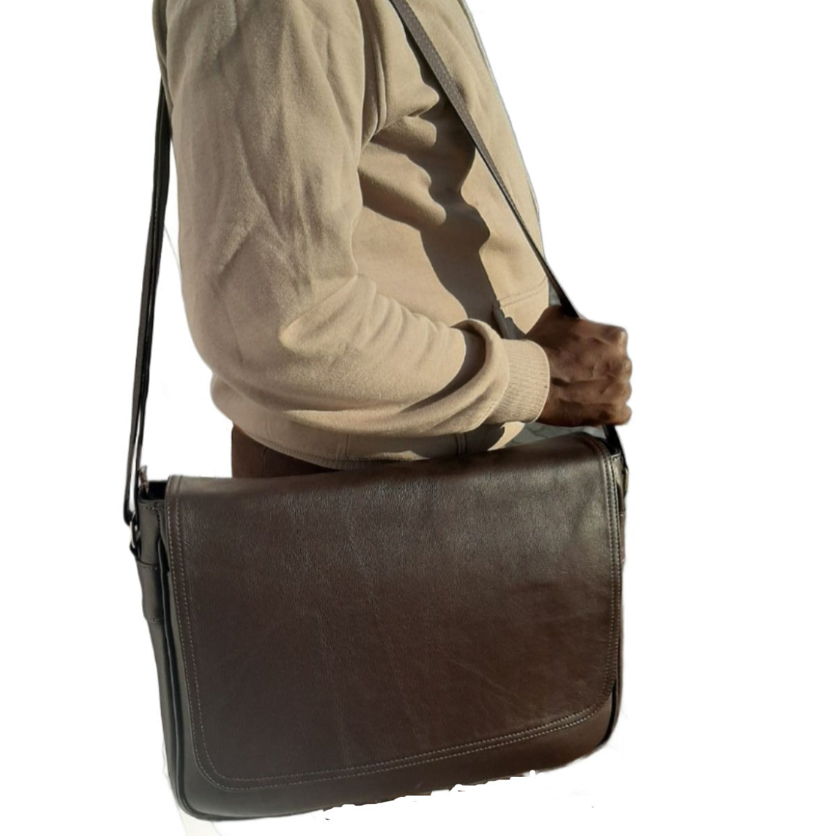 a man carrying a Men's laptop bag 15" from Cape Masai leather