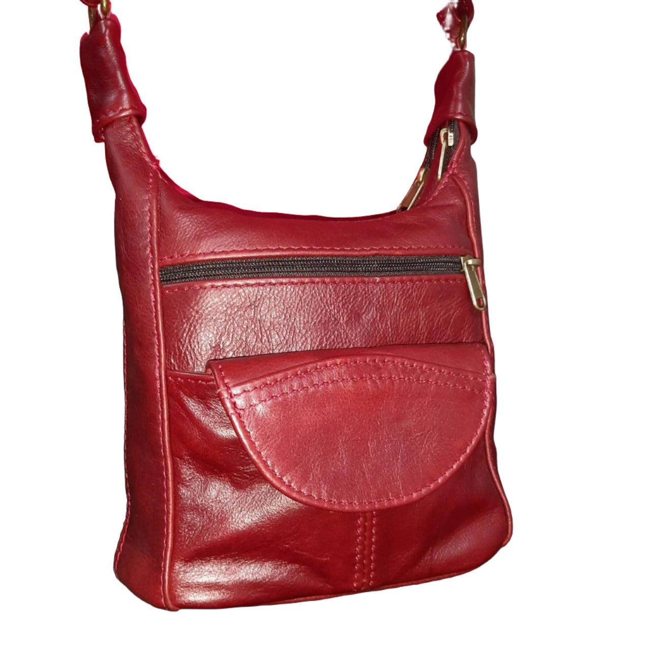 A lady carrying SH small leather bags in Cherry red colour at Cpe Masai Leather