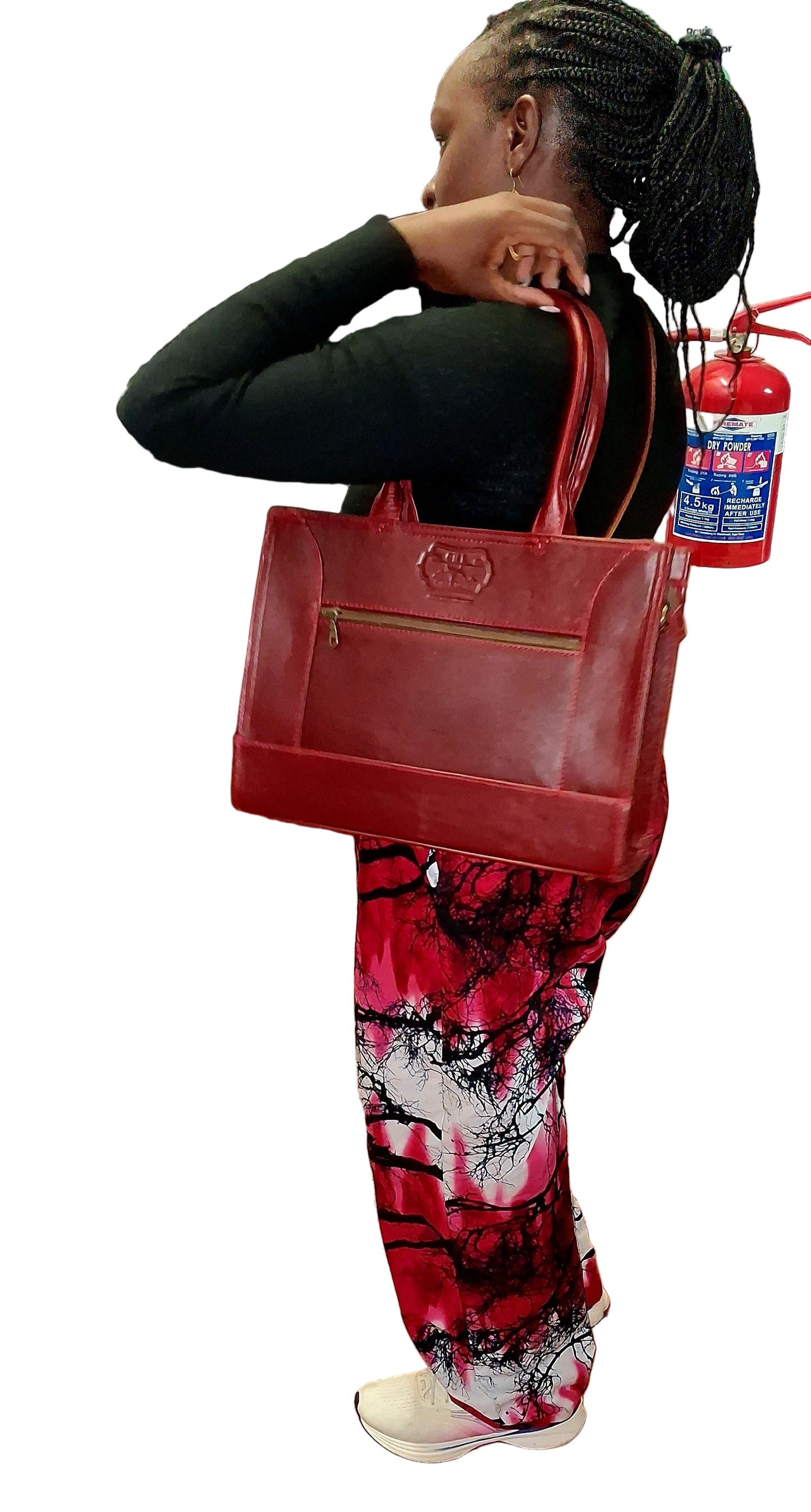 A lady carrying Kirstein 14 inches laptop bag in cherry red colour from Cape Masai Leather.