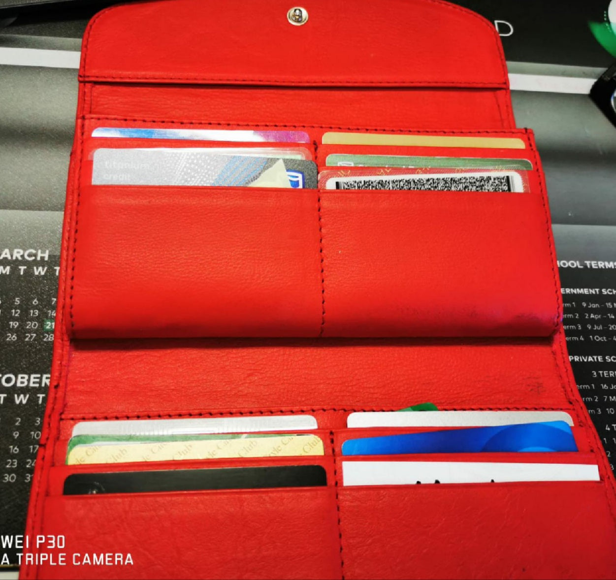 A red genuine leather hand made ladies wallets/purse