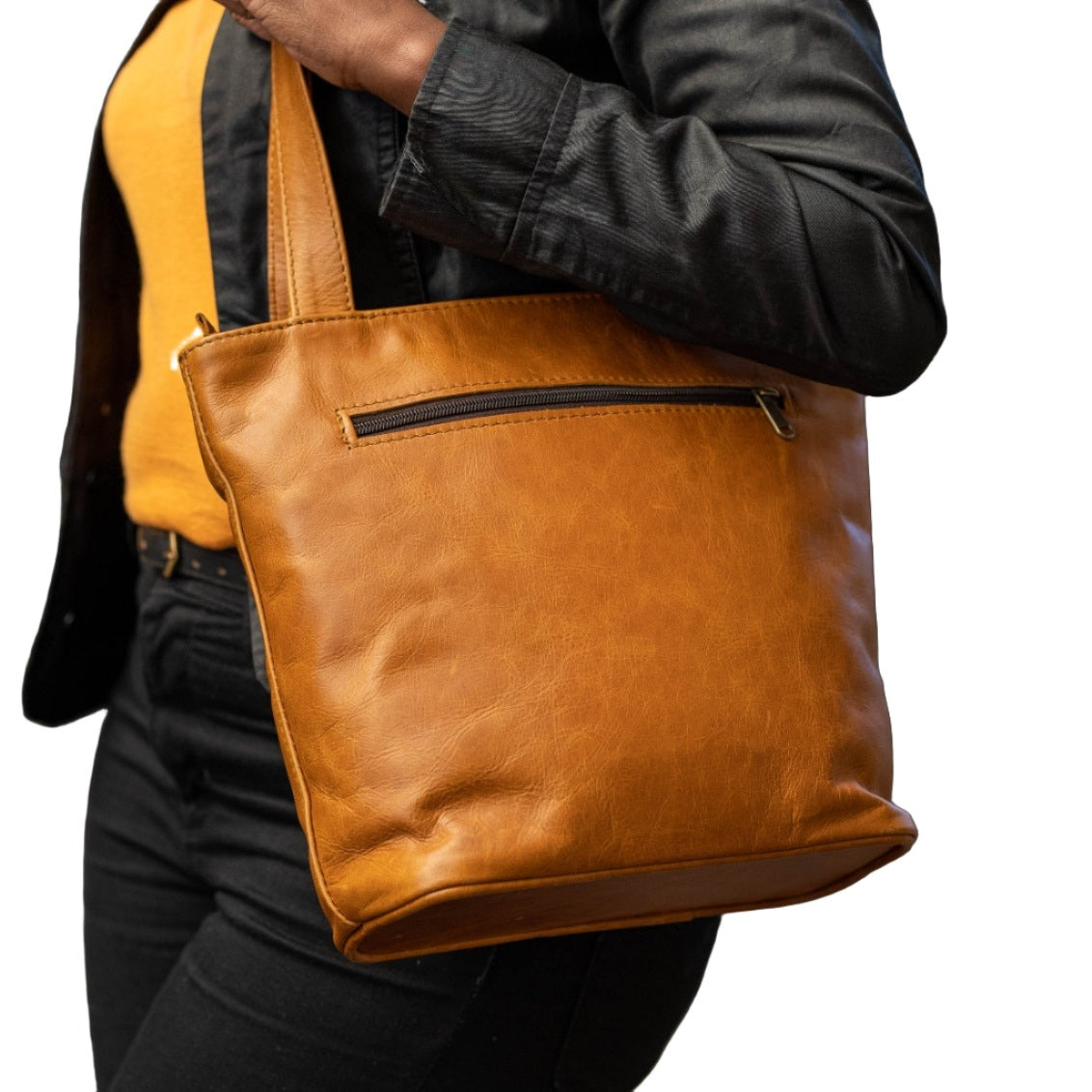 A beautiful lady carrying Cm small leather bags in light tan from Cape Masai Leather