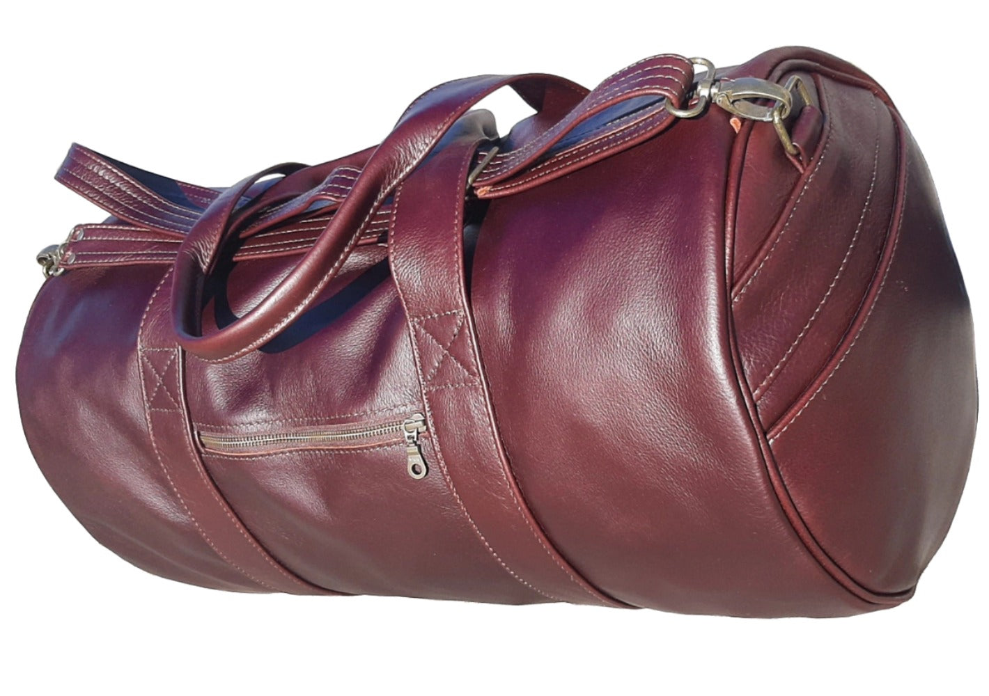 Duffle travel bags dark tan from Cape Masai Leather standing on the ground