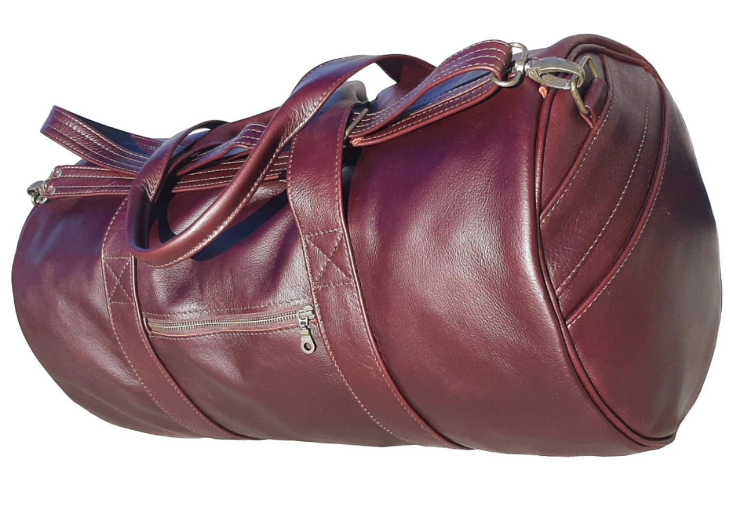 Duffle  travel  bags dark tan from Cape Masai Leather standing on the ground 