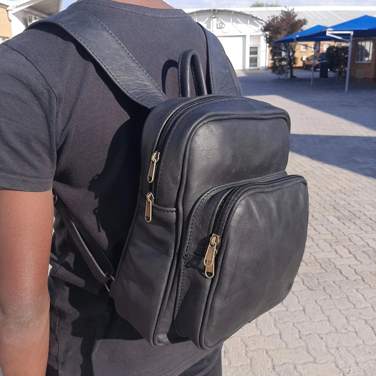 A teenager beautiful Woodlands diesel toffee black Everyday backpack from Cape Masai Leather.