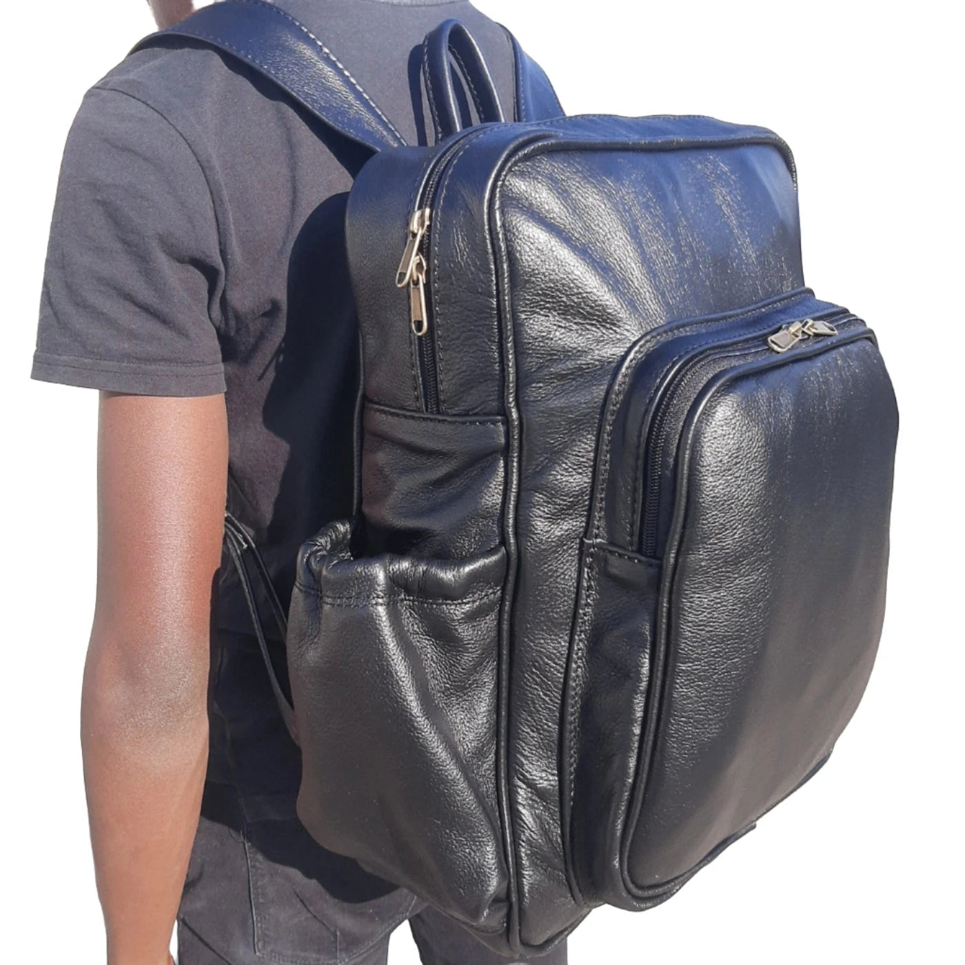 A boy carrying Everyday Leather Backpacks XL in black colour from Cape Masai Leather