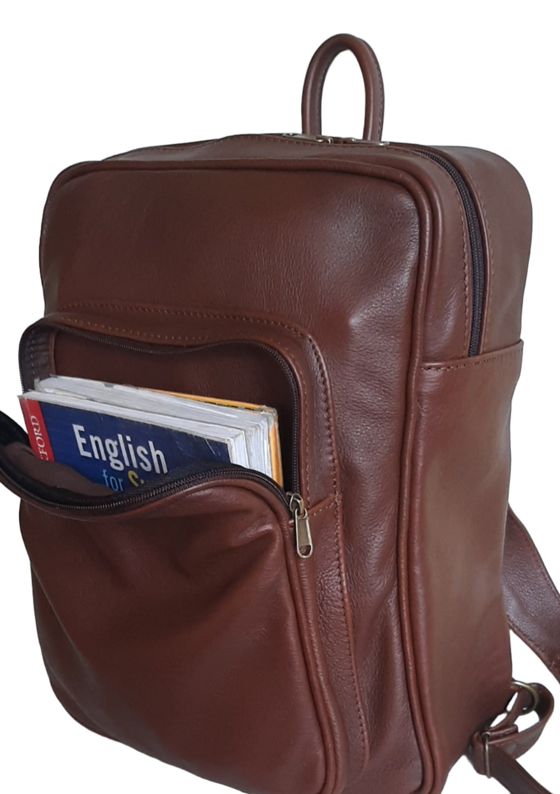 A beautiful genuine leather backpack XL with A4 size books in the front pocket , designed and made by Cape Masai leather