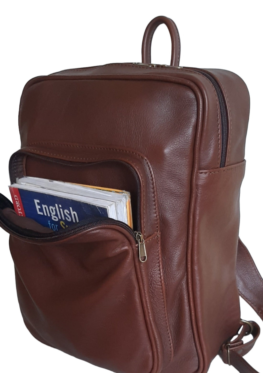A beautiful genuine leather backpack with A4 size books in the front pocket , designed and made by Cape Masai leather 