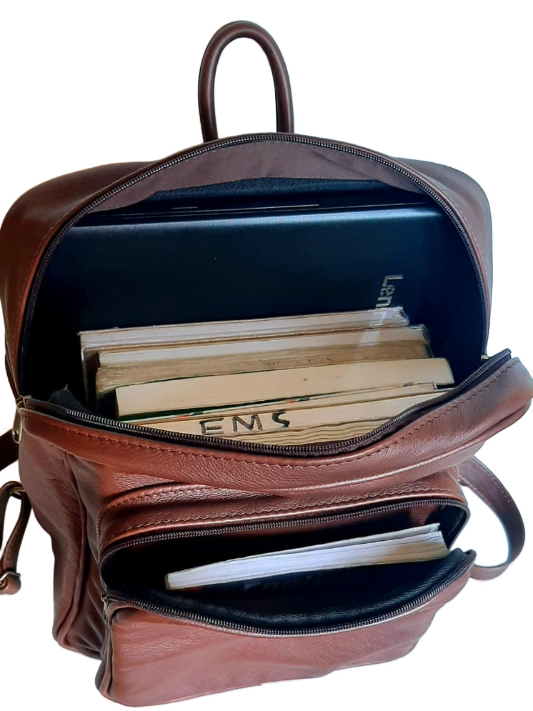 Open genuine leather backpack with 15" laptop and with books in. Designed by Cape Masai leather.