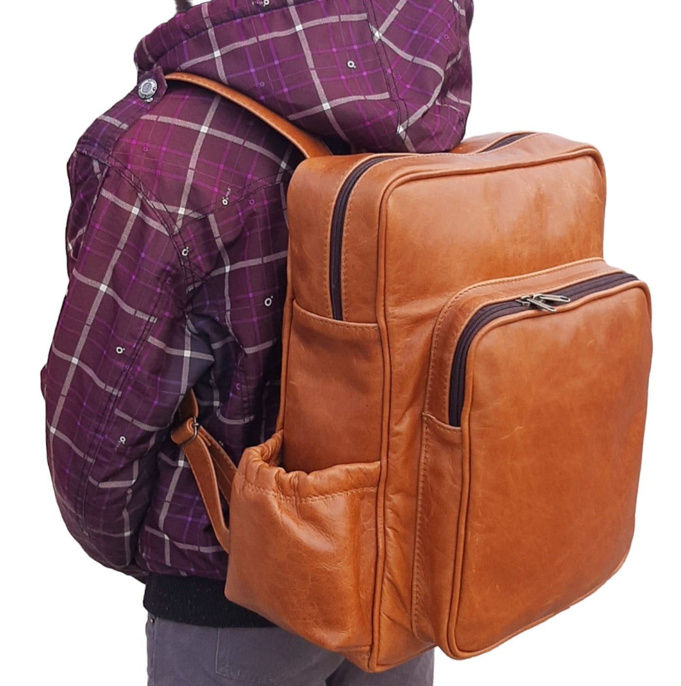 A boy carrying Everyday Leather Backpacks XL in light tan colour from Cape Masai Leather