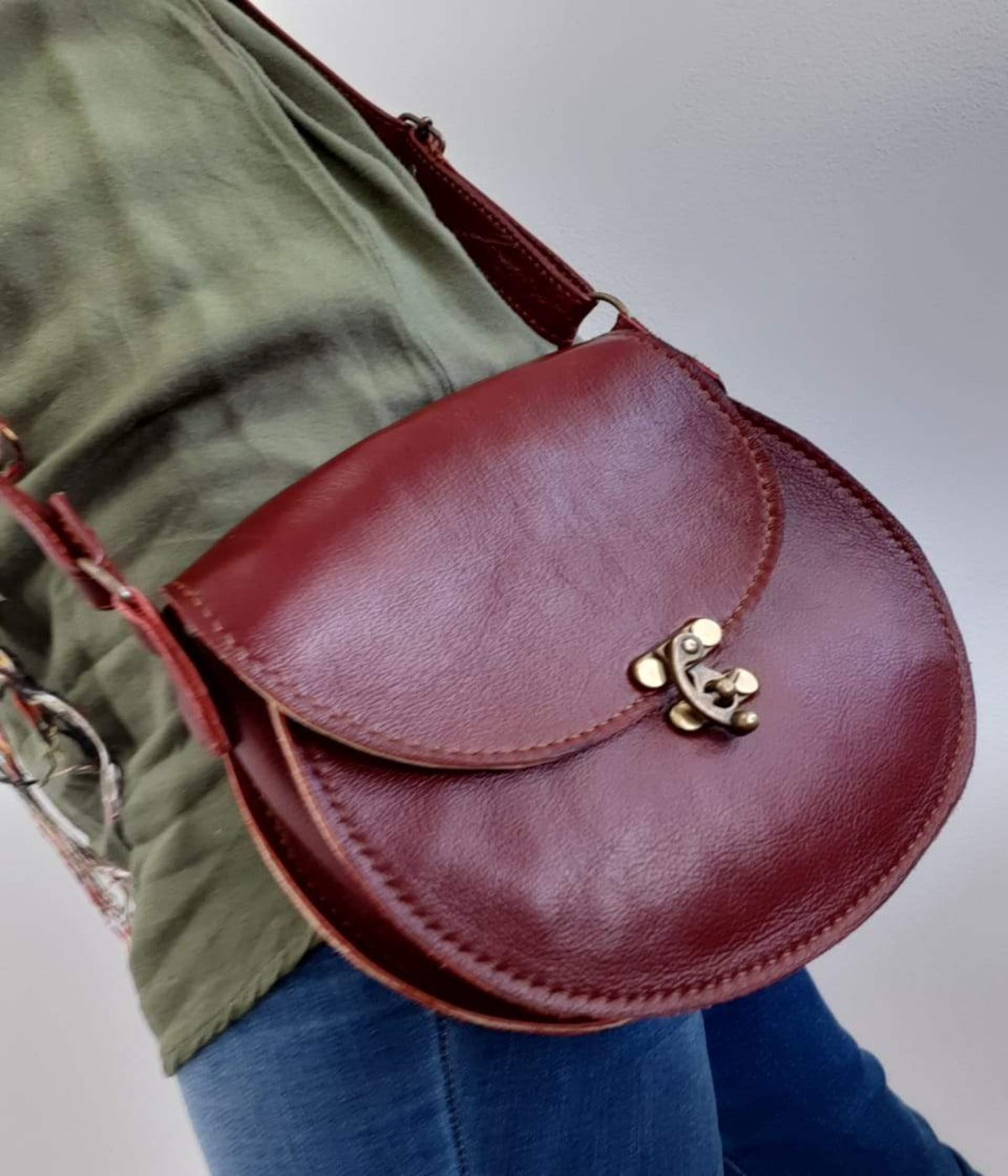 A lady carrying a beautiful crossbody D Bag small leather bags from Cape Masai leather in Cape Town
