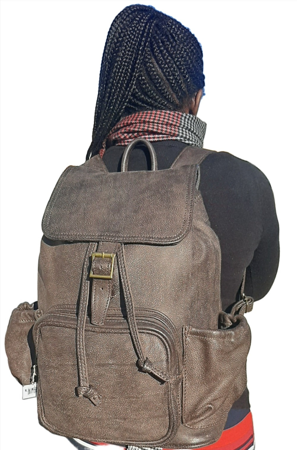 A lady carrying beautiful Woodlands buffalo  leather backpack with flap xl on her back from Cape Masai Leather