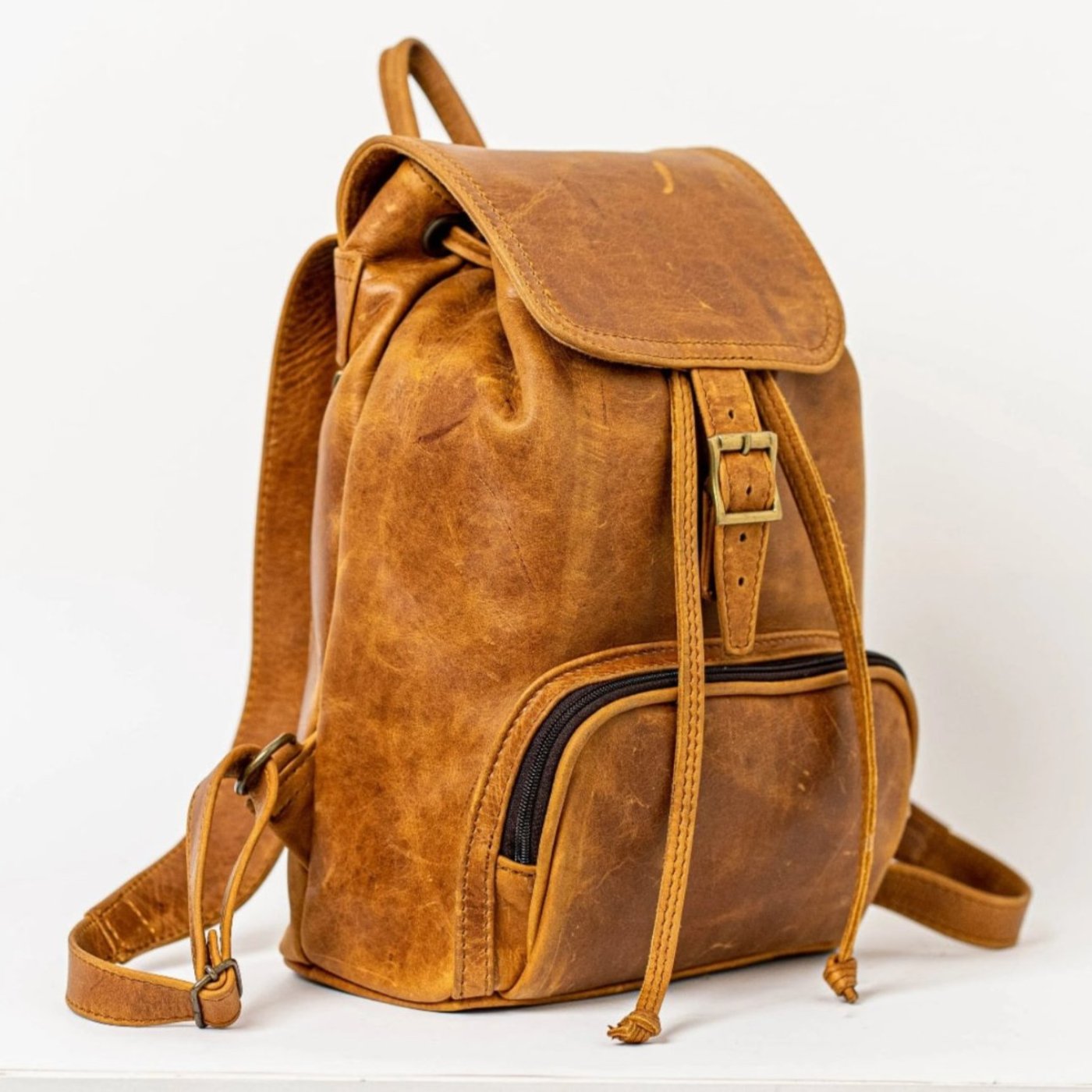 leather backpacks flap in toffee tan colour made by Cape Masai Leather