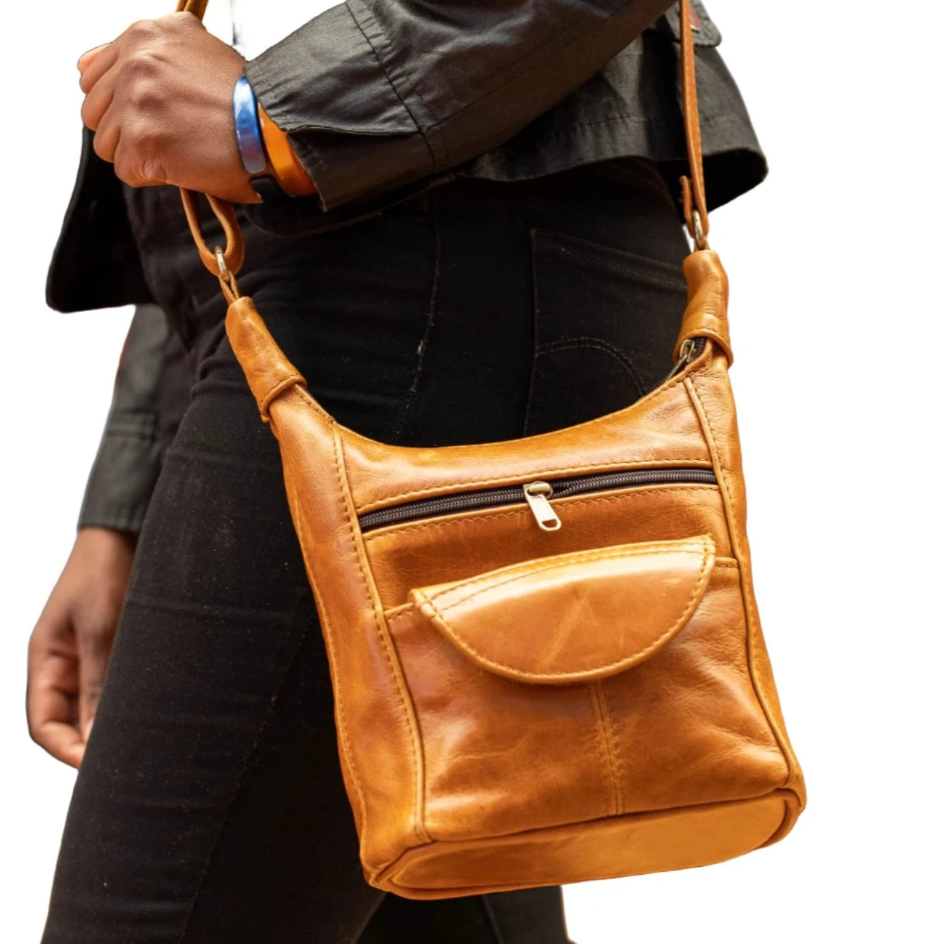 A lady carrying SH small leather bags in Light tan colour at Cape Masai leather