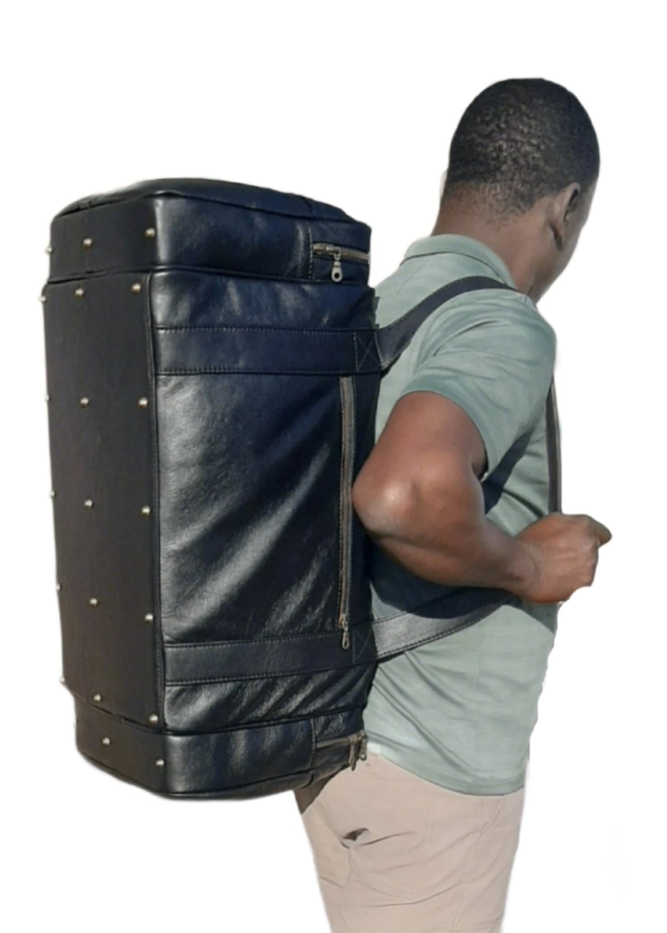 A Masai crafter carrying Masai Luggage bags from Cape Masai Leather 