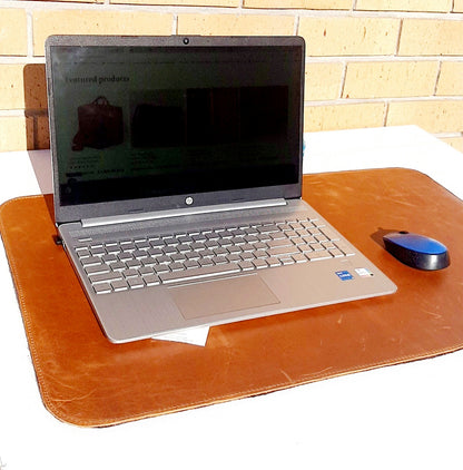 A Laptop and A5 notebook on Laptop Leather Mat in toffee tan