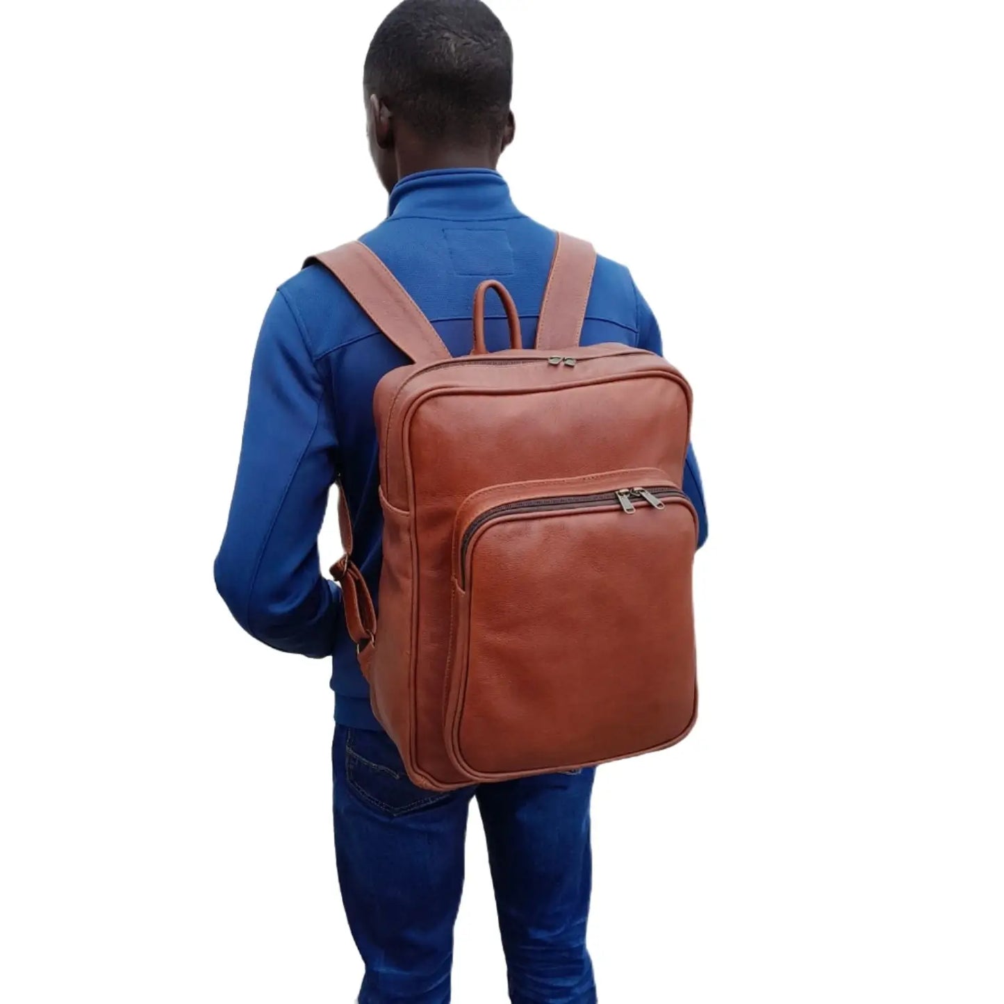 A boy carrying Everyday Leather Backpacks XL in oxblood colour from Cape Masai Leather