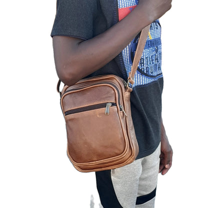 A boy carrying FannyPack leather bags Big in pecan tan colour