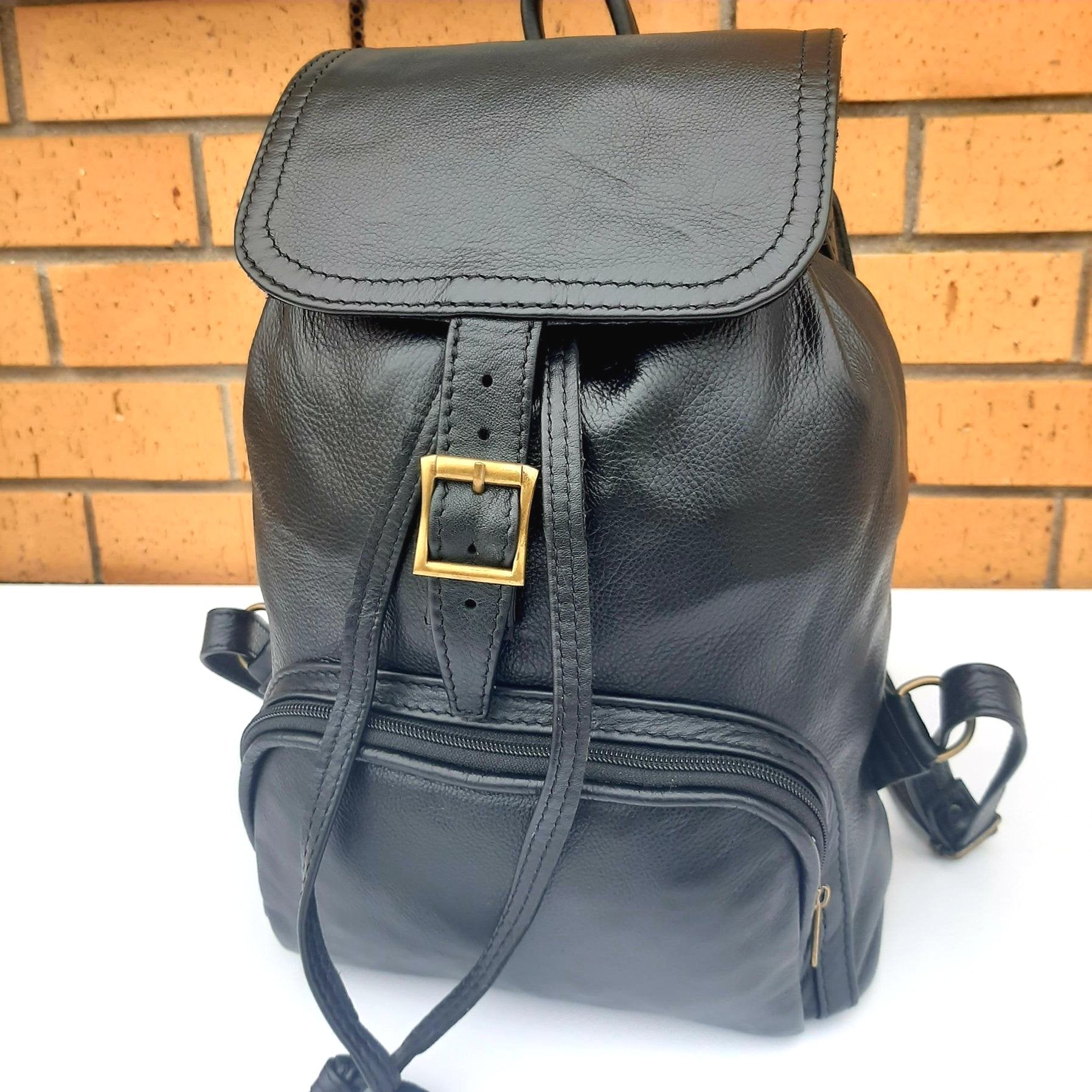 leather backpacks flap in black  colour made by Cape Masai Leather
