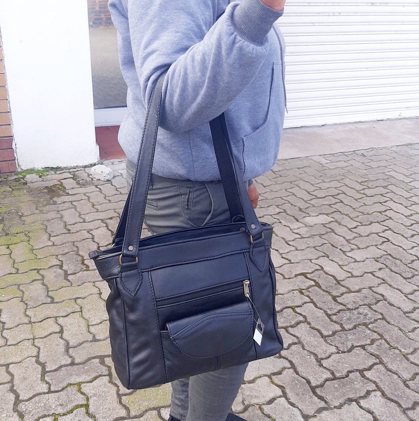 A beautiful African lady carrying Leather tote organizer in dark tan colour in black colour - cape Masai leather
