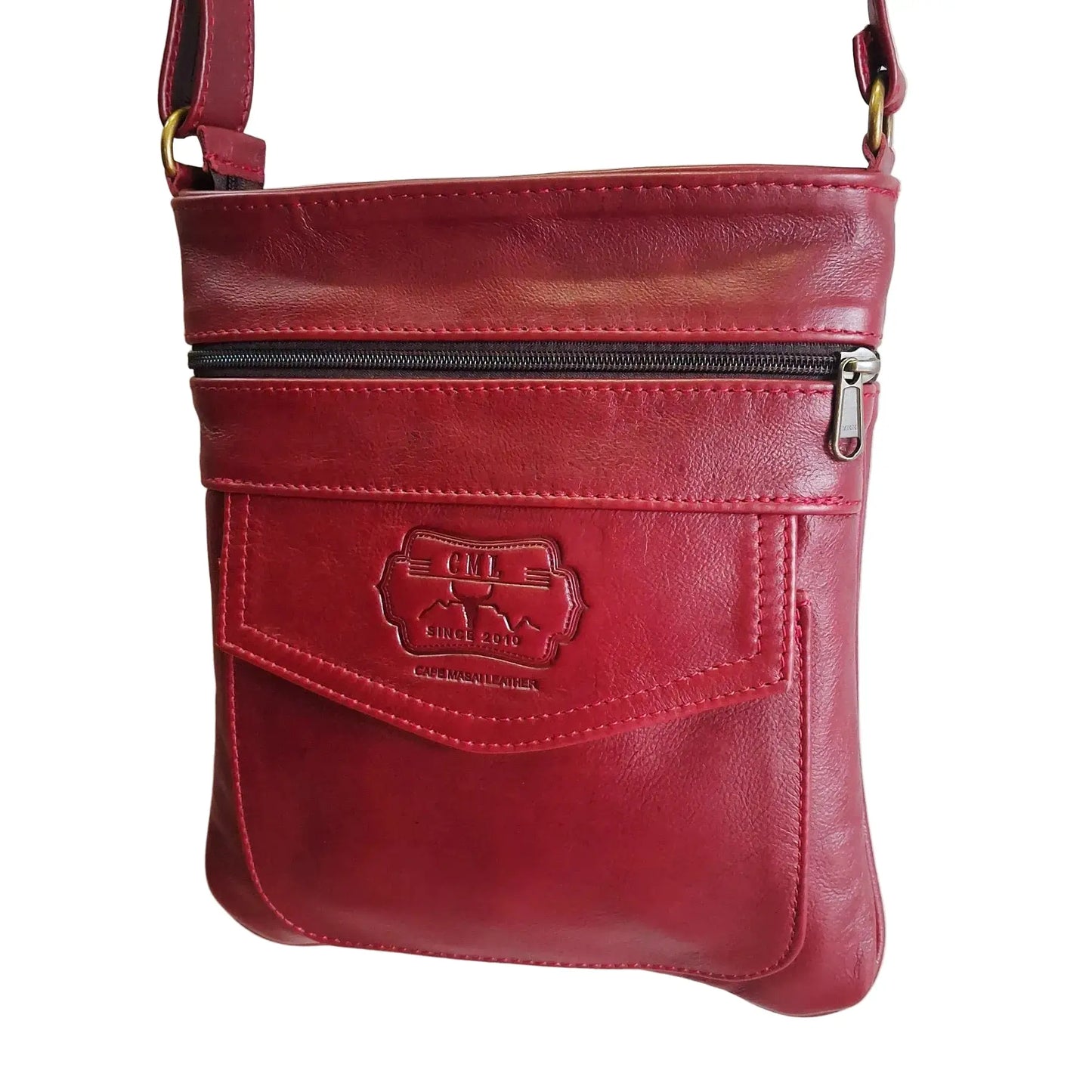 Leony Sling leather Bag in cherry red colour crossbody bag with a visible brand logo on a white background