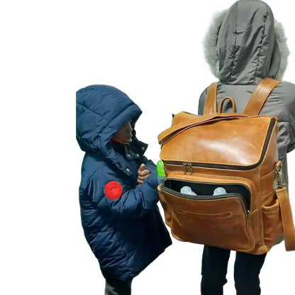 A little girl carrying a beautiful baby backpack - light tan colour