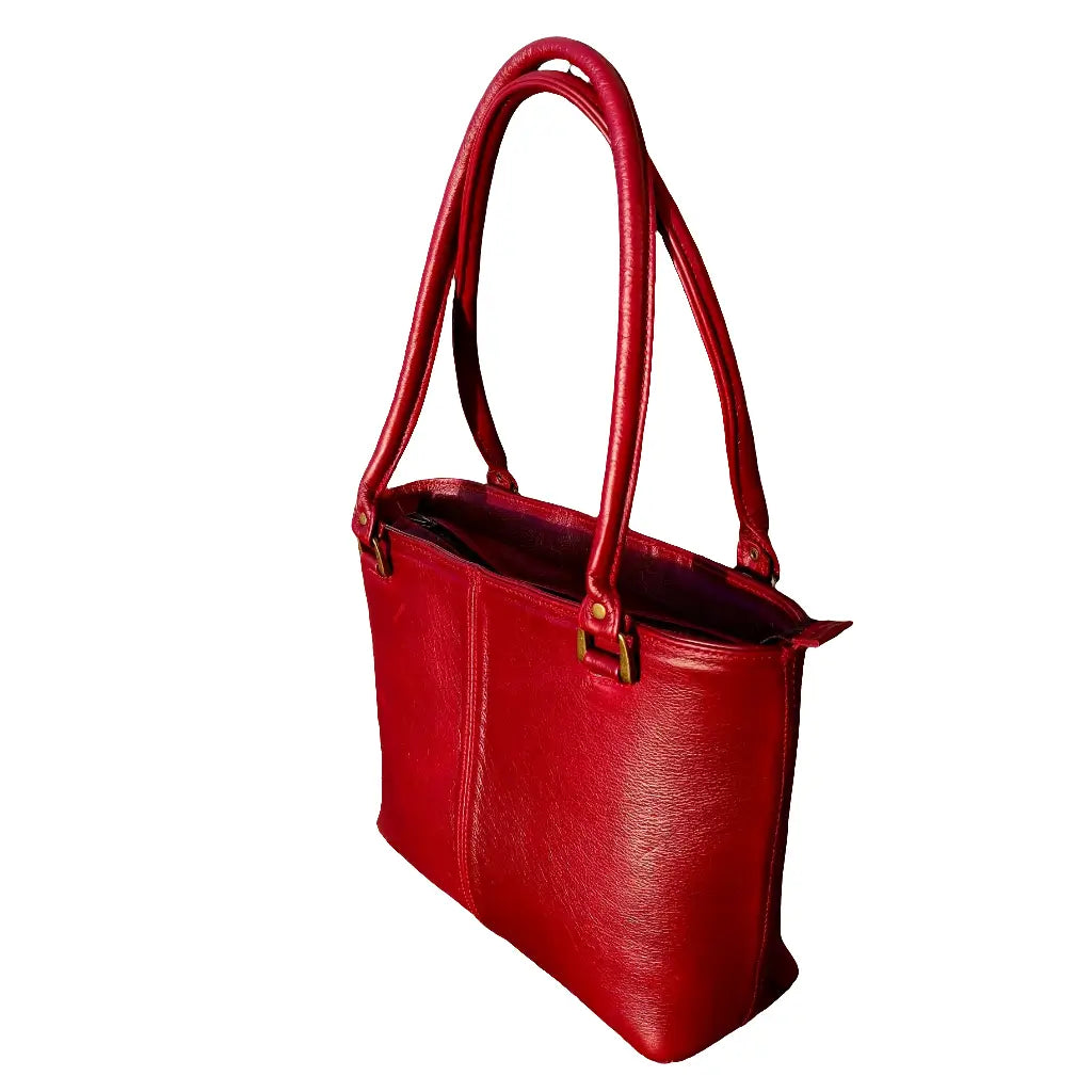 A cherry red Michelle leather tote bag on a white background made by Cape Masai Leather with handles straight up.