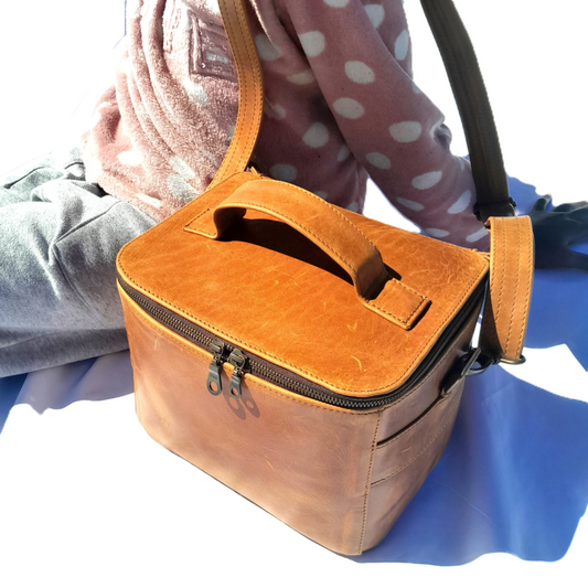 A little girl carrying Vanity bag small with shoulder strap