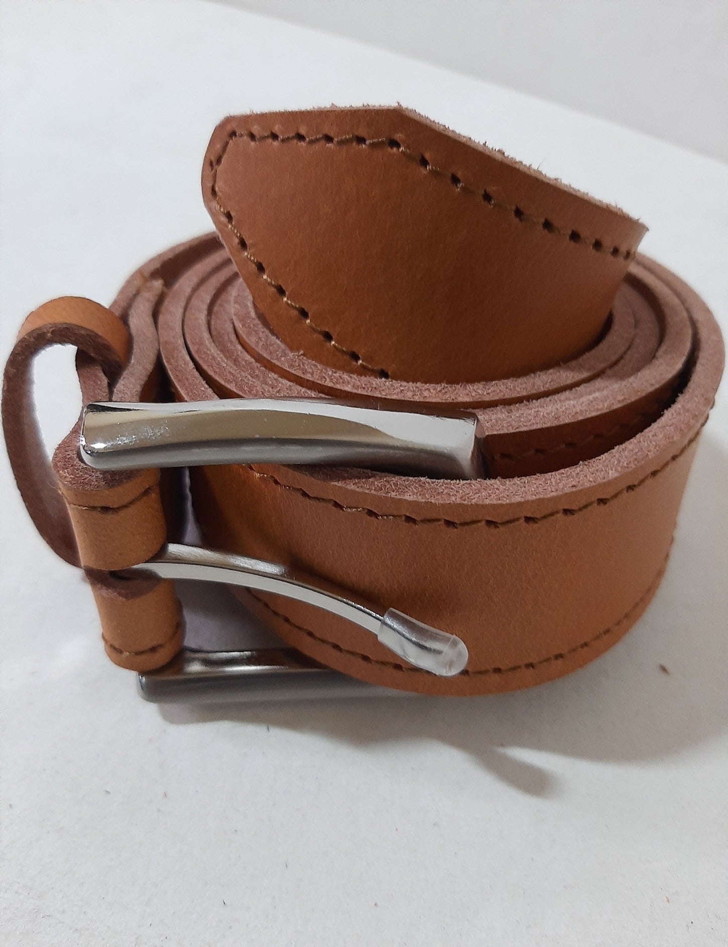 A tan Jean's genuine leather belts from cape Masai Leather
