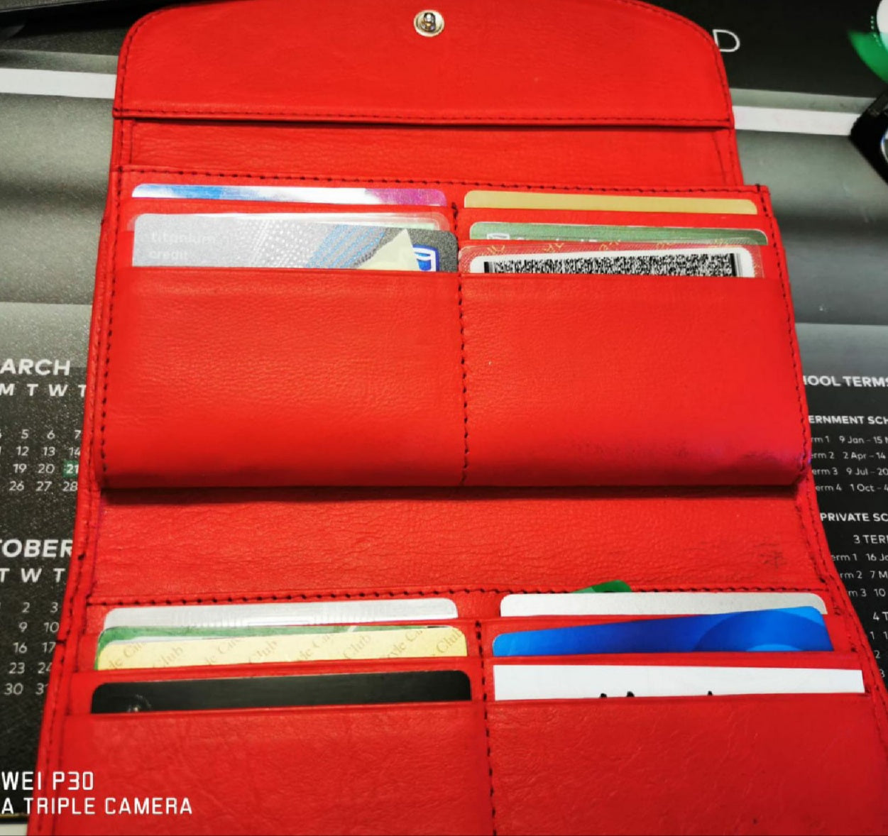 A red genuine leather hand made ladies wallets/purse 