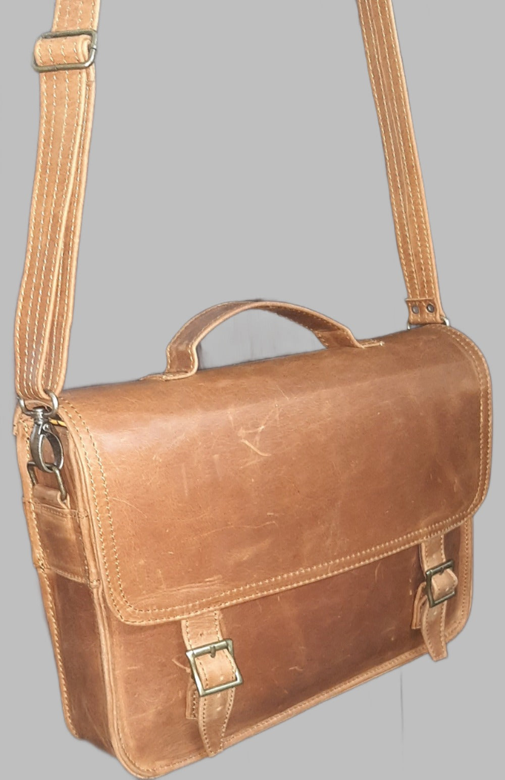 A beautiful genuine leather hand made Carryn 13-14" laptop bag in toffee tan colour 