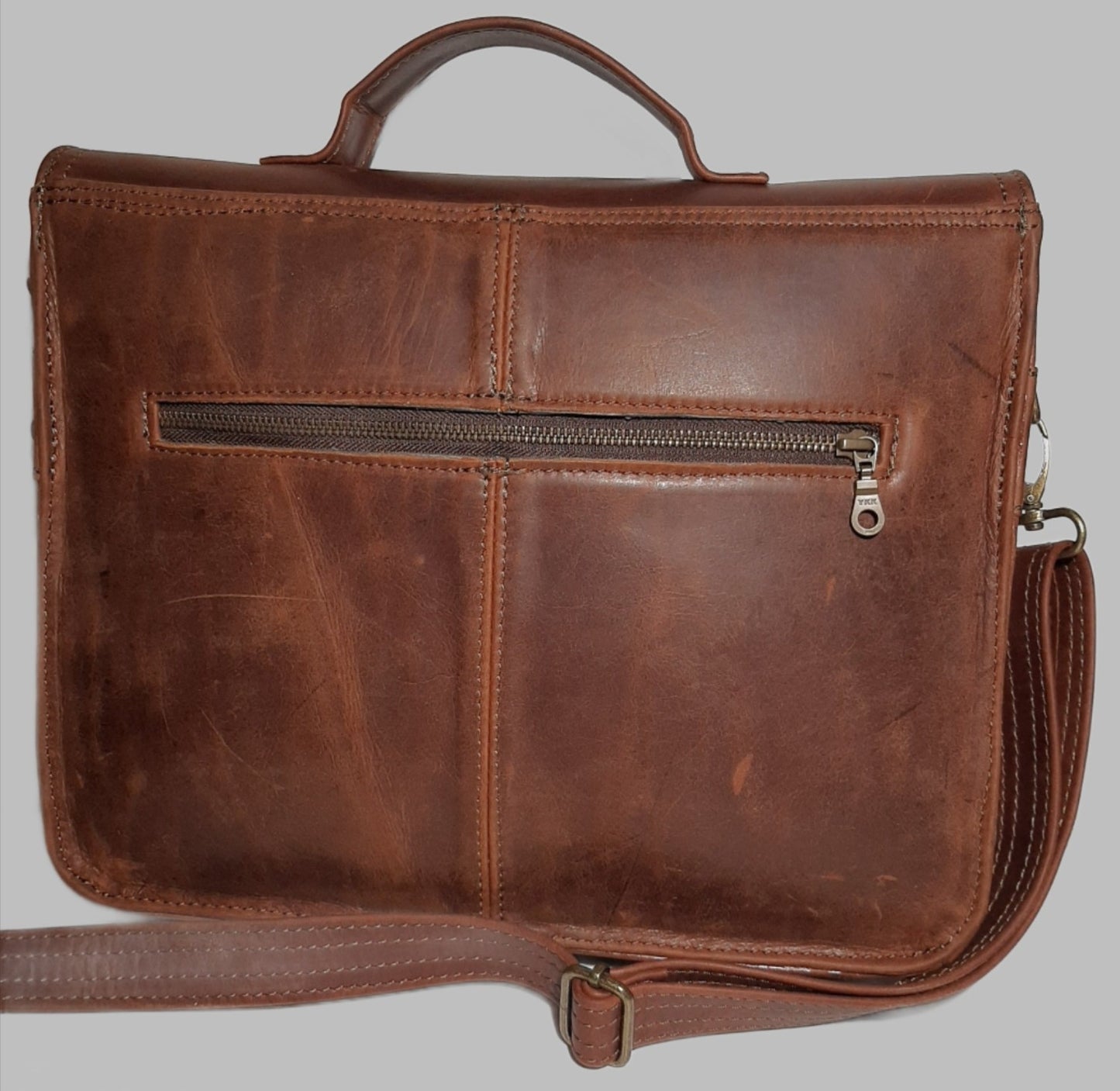 A beautiful genuine leather hand made Carryn 13-14" laptop bag in pitstop ciger / tobacco colour 