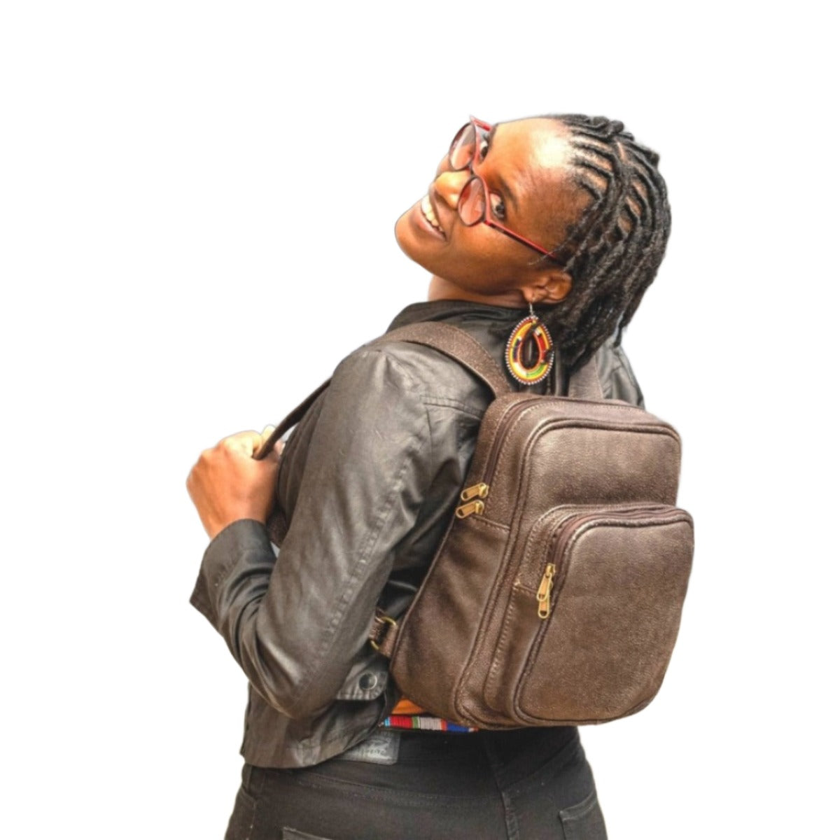 A beautiful Masai lady in black carrying beautiful Woodlands buffalo Everyday backpack from Cape Masai Leather . 