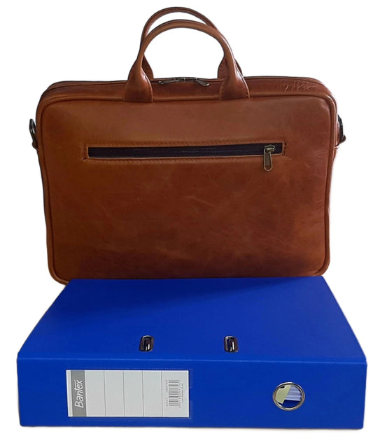 Iconic 14 laptop briefcase  Light tan on the desk behind fill folder at Cape Masai Leather