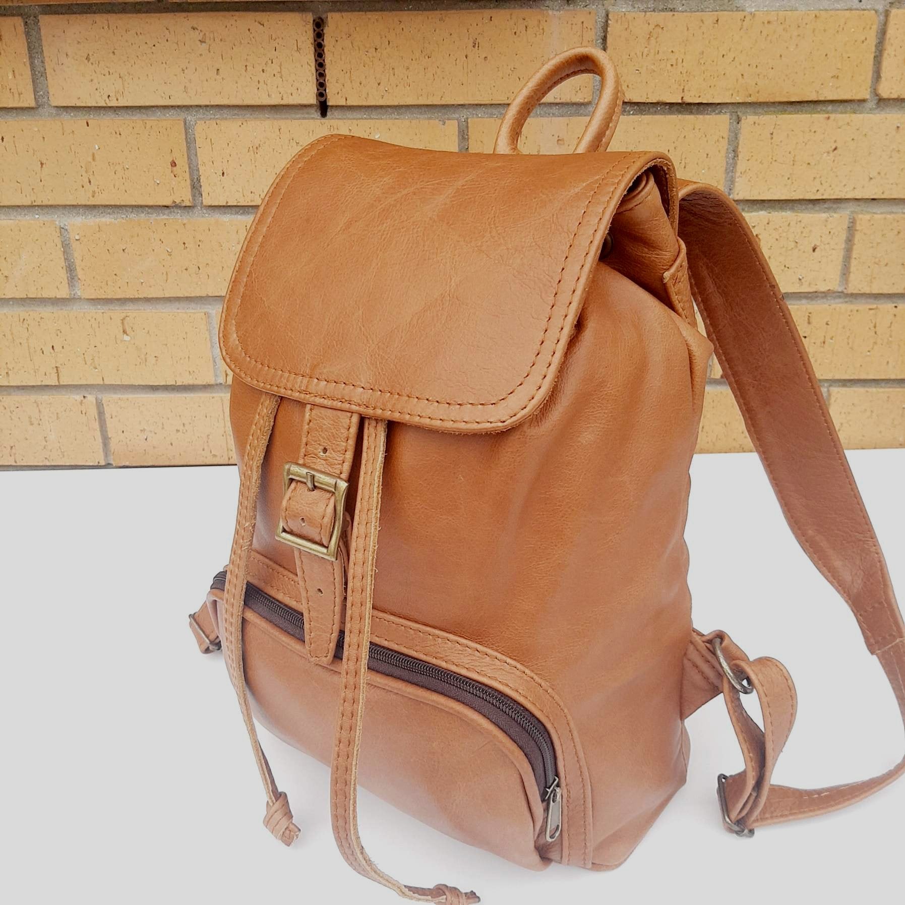 leather backpacks flap in ginger tan colour made by Cape Masai Leather