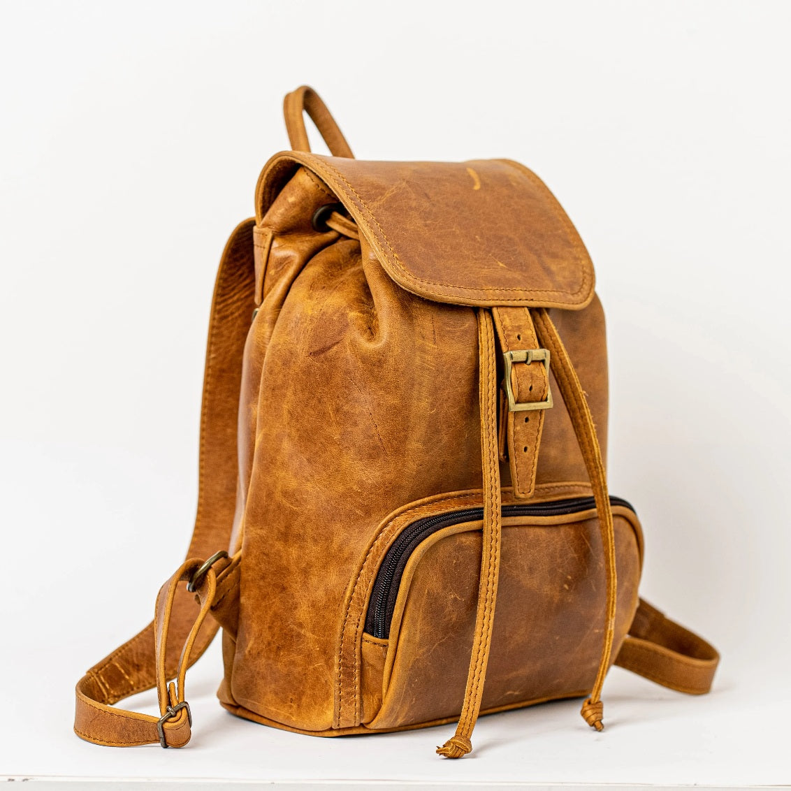leather backpacks flap in toffee tan colour made by Cape Masai Leather
