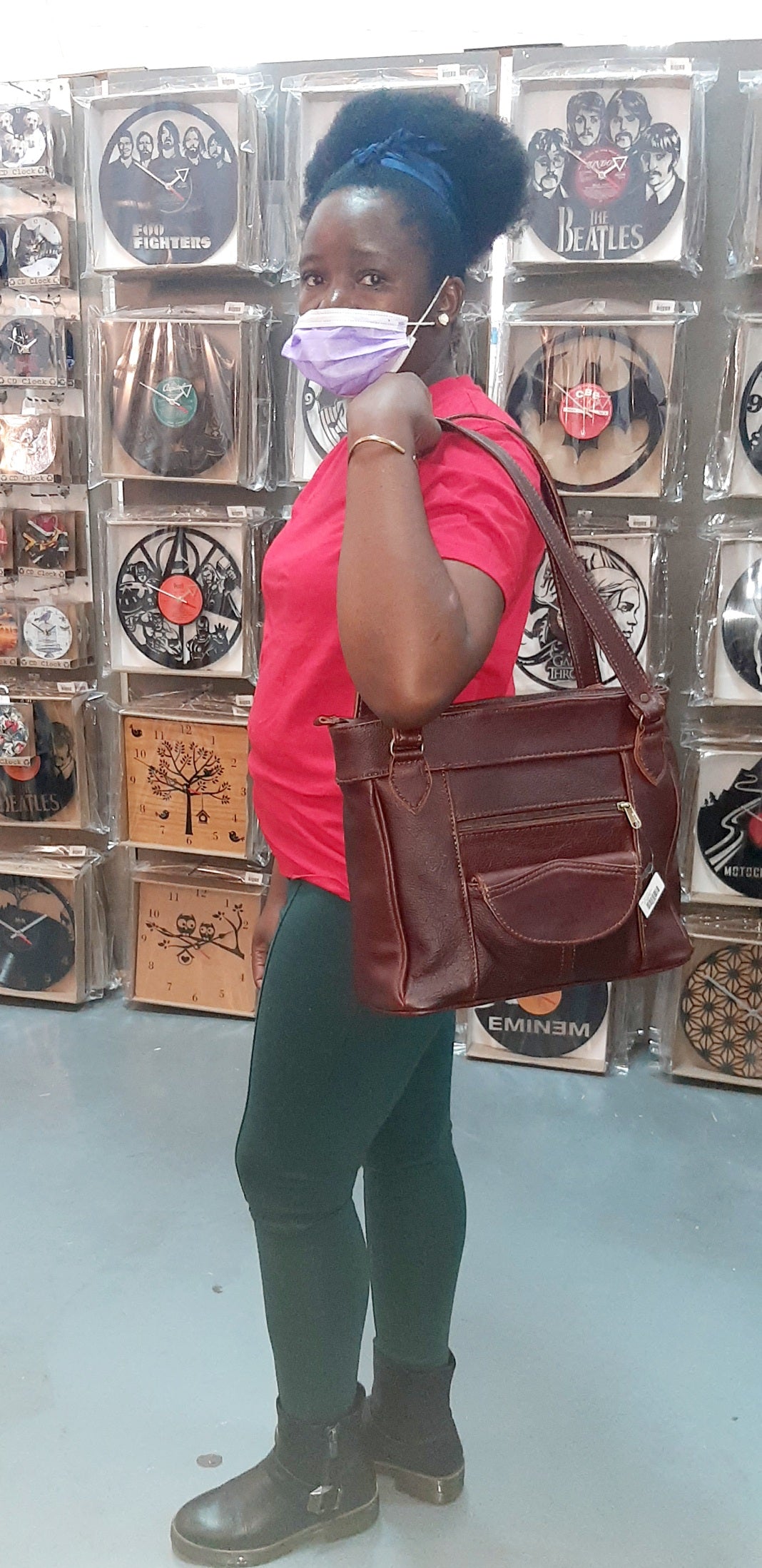 A beautiful African lady carrying Leather tote organizer in dark tan colour- cape Masai leather