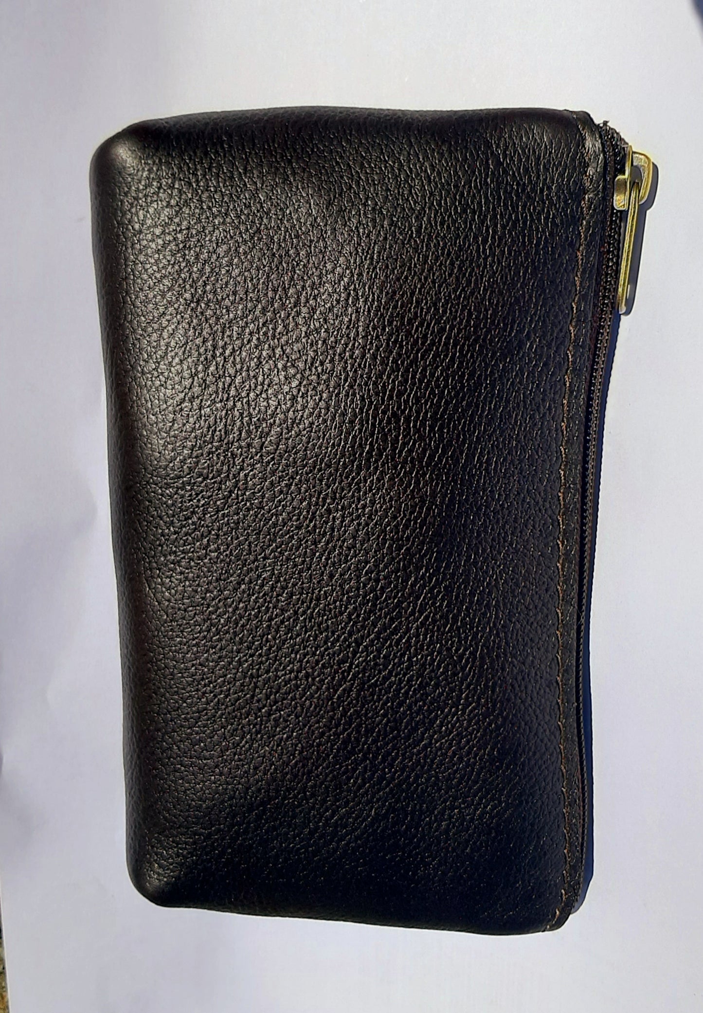 A beautiful genuine leather makeup purse in dark/chocolate brown colour 