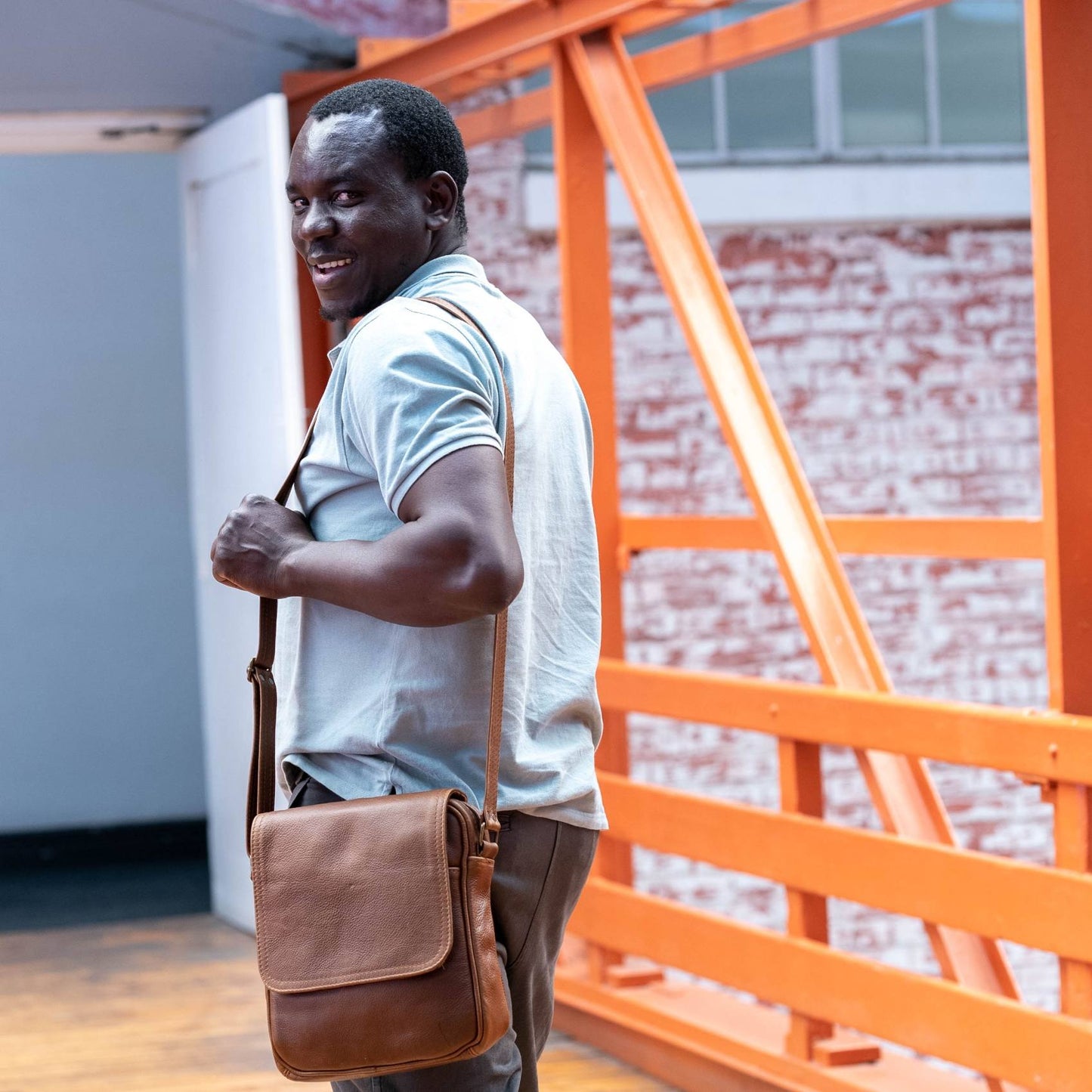 A  gentle man a beautiful crossbody messenger bag with flap from Cape Masai leather  in Cape Town 