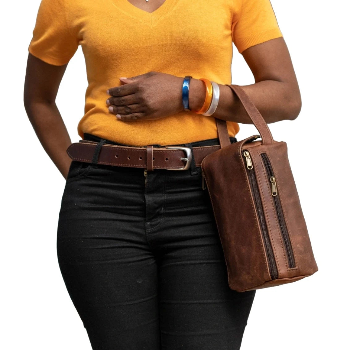 A lady carrying a toiletry-bags in pitstop cigar colour