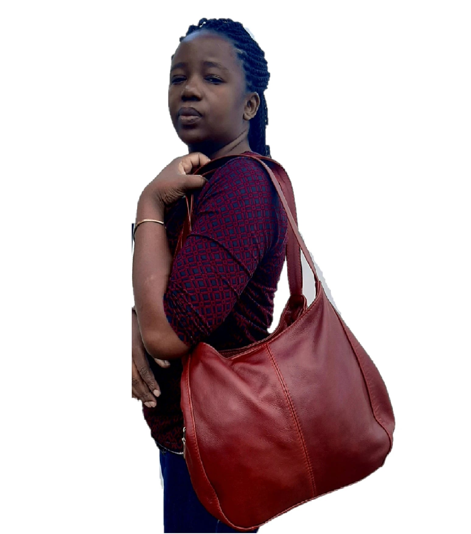A lady carrying beautiful cherry red/dark red corra leather bag from Cape Masai Leather .