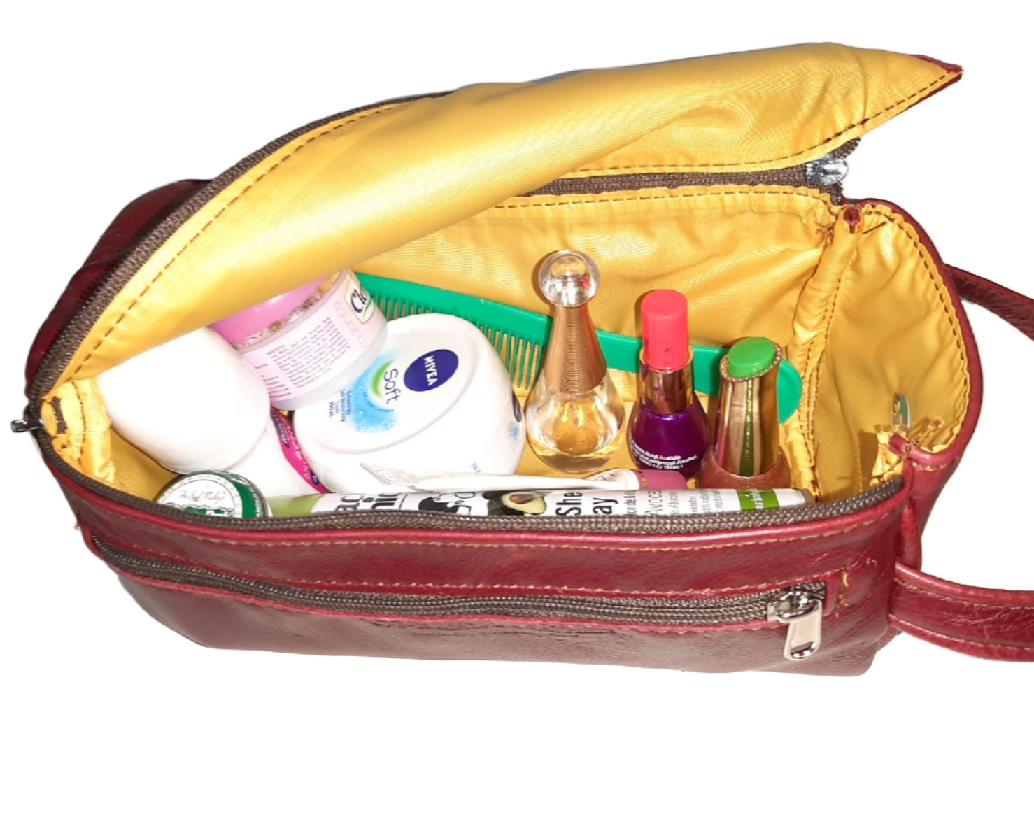 toiletry bags in cherry red colour lined with a bright yellow lining and loaded  toiletries